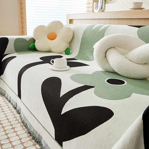 Chenia Chenille Sofa Cover in Emerald Green Clover with large flower print and cozy living room styling