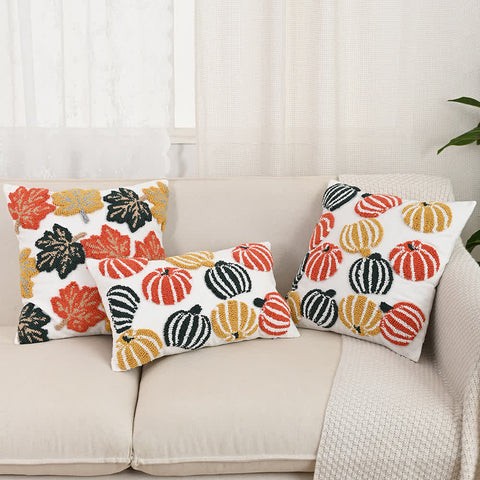 Set of Halloween tufted throw pillows and cushion covers with pumpkin and leaf designs