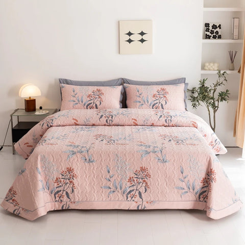 Pink floral cotton bedding set with nature-inspired print and quilted design