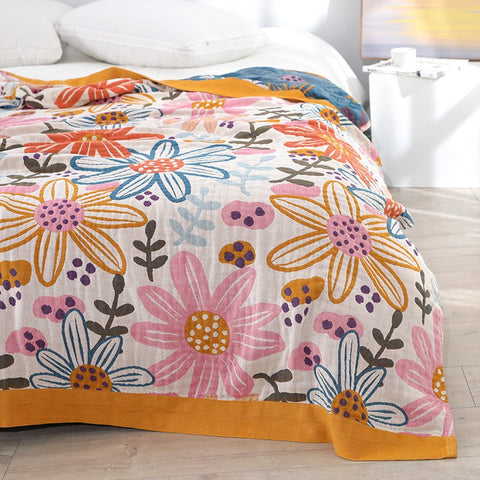Close-up of lightweight gauze blanket with colorful floral print