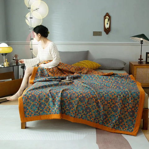 Detailed view of Nehari boho blanket’s woven floral texture, styled with tea tray, perfect as breathable summer throw