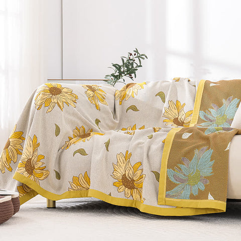 Yellow sunflower quilt displayed as couch cover in living room