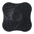 Black silicone drain catcher on white background