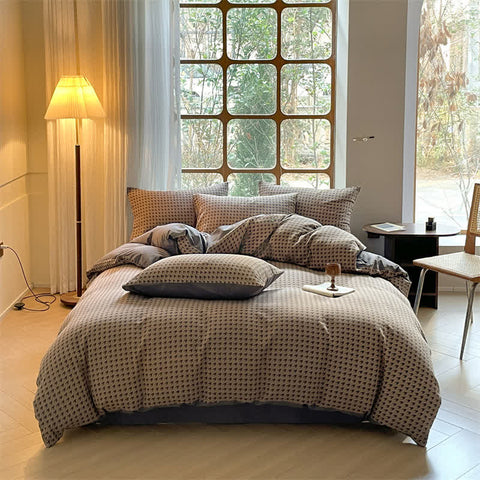 Milano houndstooth brown and gray double gauze cotton bedding set with duvet cover on bed
