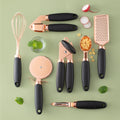 Complete modern utensil set including whisk, grater, garlic press, pizza cutter, peeler, and more. Perfect for everyday cooking and baking.