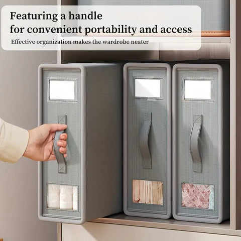 Gray storage bins with handles on a shelf, emphasizing portability and access.