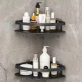 Black corner shower caddy with various bottles on a tiled bathroom wall.
