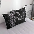 Black marble pillowcases from duvet bedding set on full bed