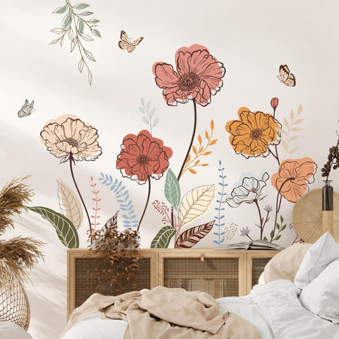 Decorative floral wall mural with flowers and butterflies in a bedroom setting.