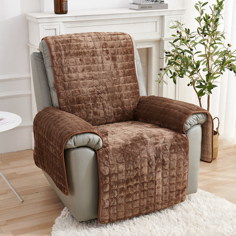 Brown quilted chair cover on a gray recliner chair in a living room setting.