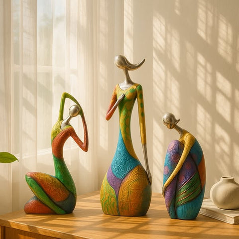Colorful ceramic figurines on a wooden surface with a soft curtain background