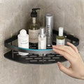 Corner shower caddy with skincare products on a tiled wall
