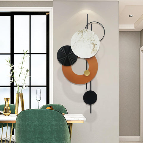 Decorative wall art with circular shapes in a modern interior setting.