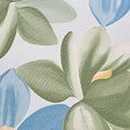 Close-up of green and blue floral pattern on a light background