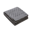 Gray knitted blanket folded on a white background