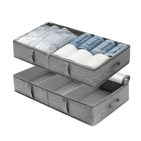 Gray storage bag with compartments containing clothes on a white background