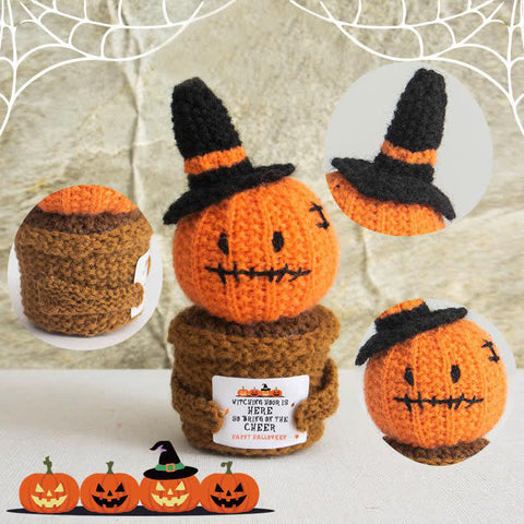 Knitted pumpkins with witch hats on a neutral background