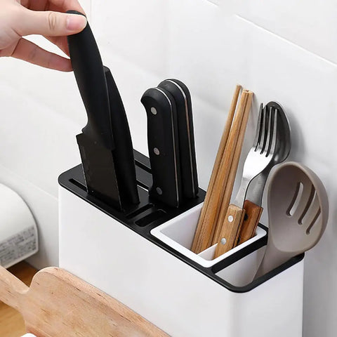 Kitchen utensil holder with knives, forks, and spoons on a white background