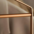Golden finish clothes organizer on wardrobe rail 