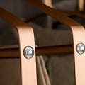 Golden finish clothes organizer on wardrobe rail