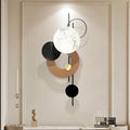 Modern wall light fixture with geometric design on a neutral wall.