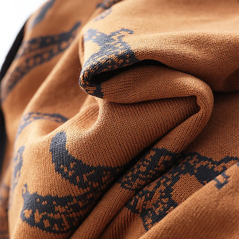 Close-up of a brown fabric with black pattern, possibly a blanket.