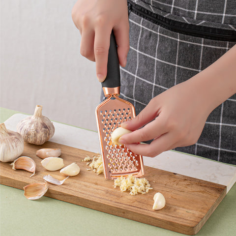 High-quality handheld grater for cheese, carrots, chocolate, and more. Part of the 7-piece kitchen utensil collection.