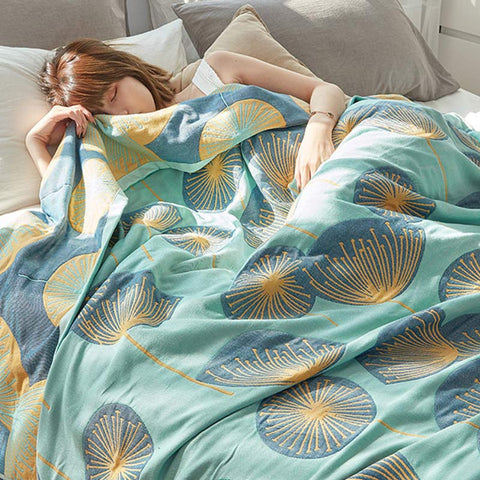 Sleeping under green dandelion cotton quilt – breathable and lightweight blanket
