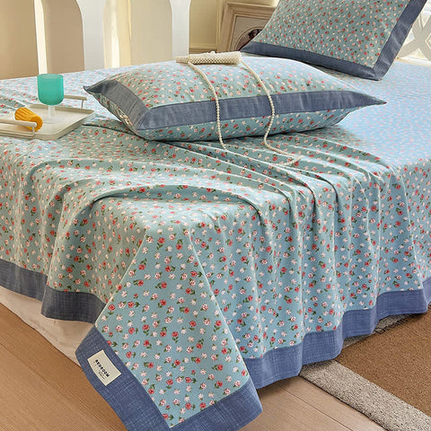 Transform your bedroom into a serene floral sanctuary, where delicate blooms create instant calmThis cotton bedspread showcases tiny ditsy florals in gentle blue and coral shades with sophisticated charcoal edging. The breathable cotton weave works beautifully as a lightweight quilt for summer or versatile coverlet for layering, while the scattered floral motifs bring cottage charm to any space.