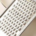 Metallic grater with a close-up of the metal surface