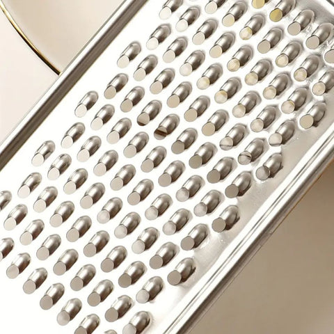 Metallic grater with a close-up of the metal surface