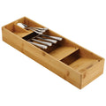 Wooden cutlery tray with angled compartments holding spoons and forks

