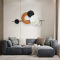 Gray sectional sofa with decorative pillows in a living room setting.
