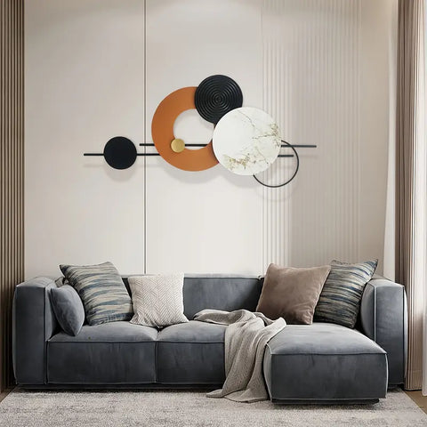 Gray sectional sofa with decorative pillows in a living room setting.