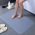 Wet feet on waterproof textured shower mat