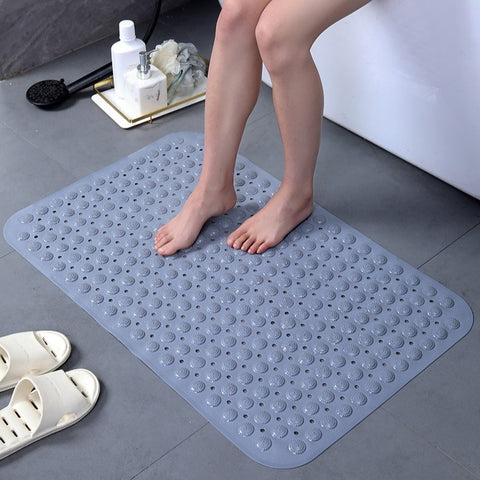 Wet feet on waterproof textured shower mat