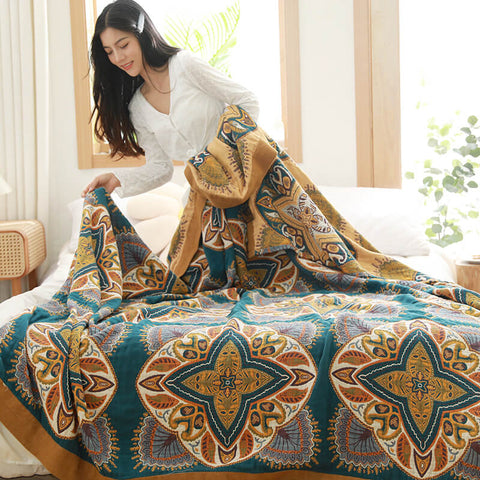 Woman arranging breathable Moroccan-style cotton quilt