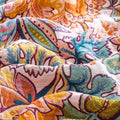 Close-up detail of Autumn Garden Cotton Throw showcasing vibrant floral and leaf patterns in warm autumn colors