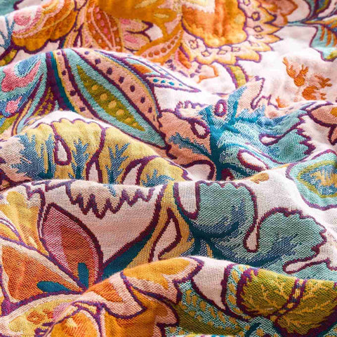 Close-up detail of Autumn Garden Cotton Throw showcasing vibrant floral and leaf patterns in warm autumn colors