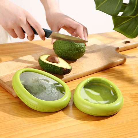 Two circular food container covers in green and yellow colors, designed to keep produce fresh.