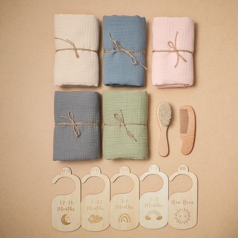 Organic cotton baby towel set with brush, comb, and growth chart markers
