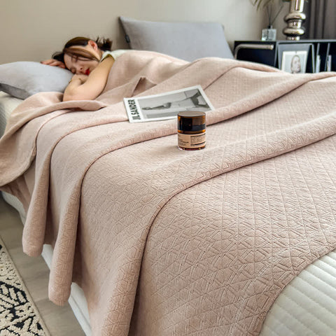 Beige muslin quilt featuring modern grid pattern