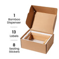 Open cardboard box containing a bamboo dispenser with text indicating contents.