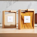 Bamboo grain and pasta storage boxes on kitchen counter
