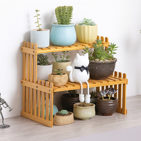 Bamboo kitchen spice rack used as a two-tier plant display stand with flower pots