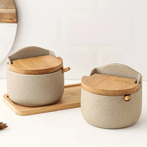 Close-up of minimalist ceramic jars with bamboo lids