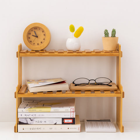 Bamboo rack used on a desk with books, clock, and glasses for multi-purpose storage