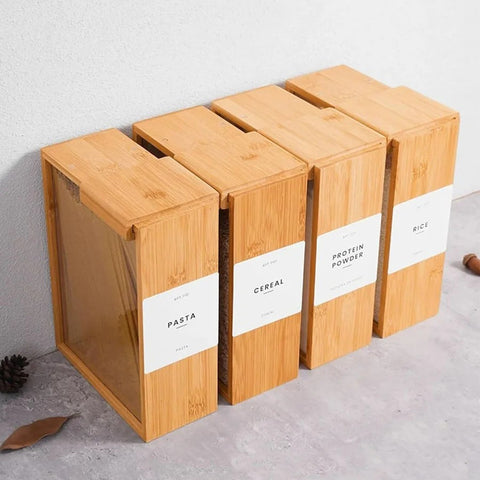 Set of wooden storage boxes with labels on a light gray surface
