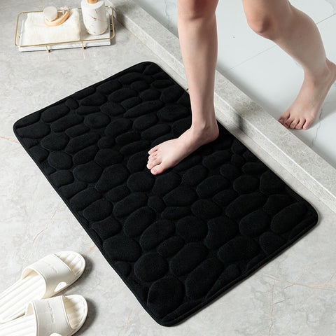 Modern black non-slip bath mat with pebble texture