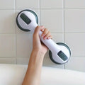 Close-up of suction cup lock mechanism on bathroom support bar